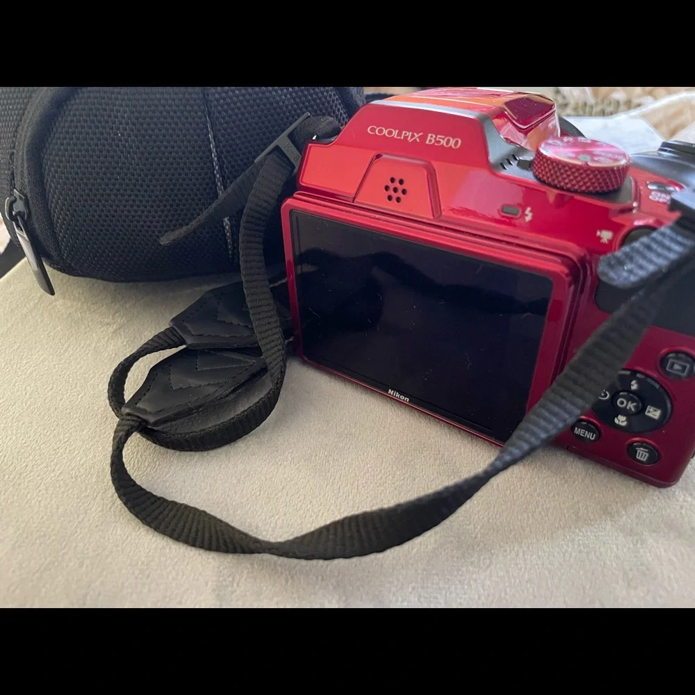 COPY - New Red Nikon camera with the bag.